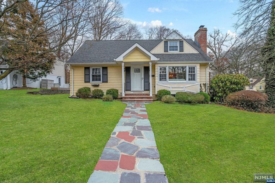 Here it is - the Ridgewood home you've been waiting for! Wonderfully updated Cape Cod-style home situated moments from downtown Ridgewood in the desirable Willard district. Traditional architectural style blends with a light and airy interior featuring a flexible and open first-floor layout. On the first floor, you will find a spacious living room with a fireplace, a sizable formal dining room, and an updated kitchen with stainless steel appliances that opens to a family room boasting a vaulted ceiling and indoor-outdoor flow with sliding glass doors to a pergola deck and expansive, private, lush backyard that is perfect for entertaining. Just off the primary living area are 2 sizable bedrooms and a full bath. Upstairs features two more large bedrooms, one featuring a walk-in closet, and a shared hallway full bath. Additional living space, ample storage, and an entry to the attached 2-car garage in the finished basement. Near blue ribbon schools & transportation to NYC!