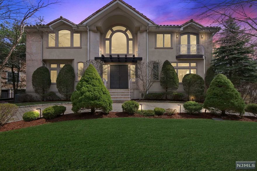 Spectacular home designed and built by renowned architect as his own residence. Large entry foyer leads to a great room with a massive copper fireplace surrounded by built in seats and 2-story windows - living room with access to the deck. Banquet sized dining room and office with builtins. Gourmet kitchen with top-of-the-line appliances, granite countertops and pantry. Powder and laundry room complete the first floor. The second level features a large landing with a 16-foot high atrium skylight. The master bedroom offers two walk-in closets and oversized master bath. There are four additional bedrooms and two full baths. A walkout lower level consists of a large recreation room with a greenhouse, bedroom, full bath and an all-purpose room which exits to the property. Generator, clay roof, beautiful marble and wood floors as well as many more amenities. A fantastic pool with terrace on an oversized property. Truly a custom and unique home.