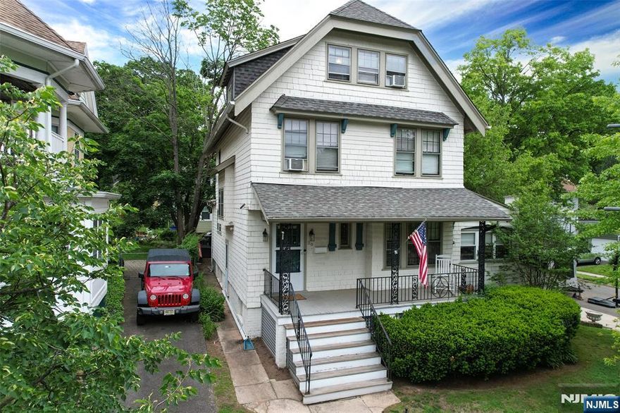 This 5-BR colonial turn-of-the-century beauty is an architectural gem, & located in the fantastic Watsessing Park neighborhood of Bloomfield! Breezy front porch opens to spacious and unique foyer- w/ built-in seating, parquet floors, leaded glass & intricate mouldings. Original Edwardian opulence is showcased in the wood columns framing the sunny LR. French doors lead to a relaxing den/office w/ ceiling fan. The formal DR has pocket doors, brick FP, beamed ceiling, plate rail & stunning built-in window seats.The kitchen sports original subway tiles, butler pantry, & mud room off of the rear porch. Upstairs, the 2nd fl has 4 good size BRs, full bath & linen closet. 3rd floor offers a 5th BR and a GREAT opportunity to finish a large walk-in attic for an additional bathroom, office, laundry room, rec room, you name it! Partially finished basement has laundry, storage, PR, utilities room, & bonus room. Easy access through the basement to the attached 2-car garage. Updated 200 amp panel offers potential for adding central AC, too! Great corner lot features a good-size yard and mature plantings all around. Conveniently located near Carteret & Watsessing Parks, Bloomfield train station (only 10-12 minute walk), and 23 Skidoo Cafe (A neighborhood fav!) around the corner. THIS is the one!
