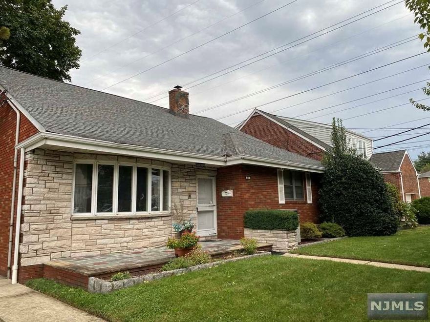 Spacious all brick and stone 3,560 sq. ft. 5BR, 3FB two-family home located on a lovely street close to schools, shopping and in close proximity to NYC transit. The first unit has spacious rooms throughout with lovely entry, living room, dining room, spacious updated eat-in kitchen, den, 3 very nice sized bedrooms and laundry in unit. The sunroom leads out to lovely yard. The second unit is on the second floor and has a nice size living room, spacious eat in kitchen, two nice sized bedrooms, a full bath and laundry in the unit. The basement is finished and has a rec room, summer kitchen and full bath which has the potential for a third unit. This home is a great investment opportunity for the discerning buyers. Do not miss it!