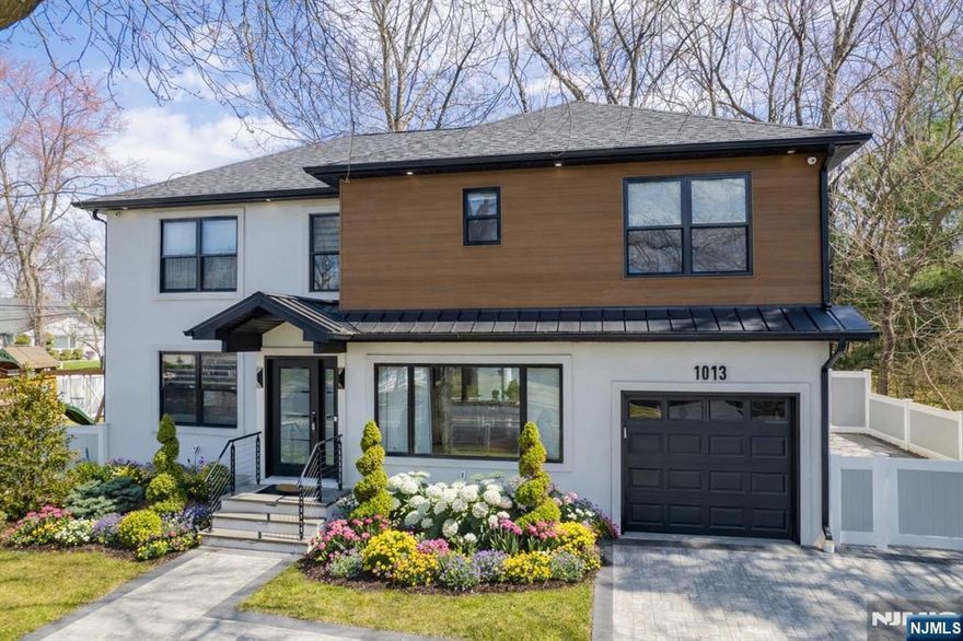 Welcome to refined living in the heart of New Milfordâ€”where modern luxury meets everyday comfort. Rebuilt in 2022, this stunning home showcases high-end finishes, designer touches, and top-of-the-line appliances throughout. Featuring 4 spacious bedrooms, each with its own private bathroom and walk-in closet, this home offers the perfect blend of privacy and convenience. Enjoy a thoughtfully designed layout with a bright living room, elegant dining area, and a chef-inspired kitchen ideal for both daily living and entertaining. The fully finished basement adds versatile space for recreation, a home office, or guest accommodations. A 1-car-attached garage plus 4 additional parking spaces provide ease and accessibility. Step outside to your backyard oasis, complete with a fully equipped outdoor kitchenâ€”perfect for hosting and making lasting memories. Ideally located near houses of worship, top-rated schools, parks, and local shopping, New Milford offers a welcoming suburban feel with convenient access to nearby towns and commuting routes. Experience elevated living in a vibrant, community-focused neighborhood, this is the home youâ€™ve been waiting for.