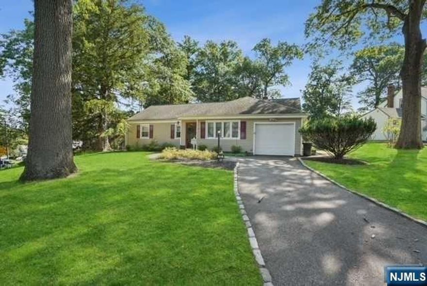 PICTURE PERFEC CLASSIC RANCH features ONE FLOOR LIVING AT IT'S BEST! Absolute "must see" hoe, ideally nestled on charming corner lot, CONVENIENTLY LOCATED JUST A SHORT WALK TO TOWN CENTER, SHOPPING, NYC BUS AND MORE! This lovingly maintained home boasts front vestibule, living room, dining room, eat-in kitchen w/door to spacious 3 season room and patio, 3 spacious bedrooms, laundry and 1 car attached garage. The backyard is fully fenced and great for enjoying the outdoors! Many upgrades include bathroom, vinyl siding, central A/C, windows.