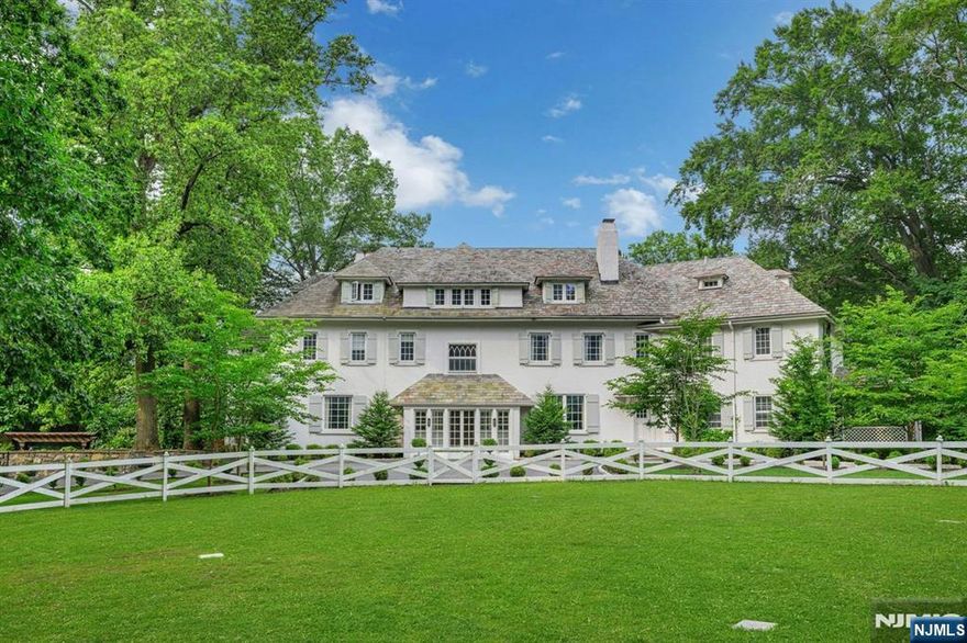 Behind the historic gates of Llewellyn Park, Americaâ€™s first planned gated community, this four-acre estate originally known as The Oakbrook Estate and built for the Colgate Family offers architectural legacy, privacy, and thoughtful modernization at a compelling new price. The main residence has been carefully renovated to honor early-20th-century craftsmanship while select bedroom and bath spaces remain opportunities for a purchaserâ€™s design vision. An attached private apartment with its own entrance offers flexibility for extended stay guests or live-in staff. A separate income-producing carriage house generates approximately $43,000 annually, with lease in place through 10/31/27. The grounds create a true resort setting, anchored by a heated in-ground pool and an extraordinary 3,000 sq ft pool house ready to be completed as a cabana, event space, additional living quarters, golf simulator retreat, or wellness pavilion. Spanning three parcels across four acres and minutes from Montclairâ€™s dining, culture, and direct NYC access, this is a rare opportunity to own scale, history, and future upside within one of the regionâ€™s most storied enclaves. Annual property taxes approx. $61,717.