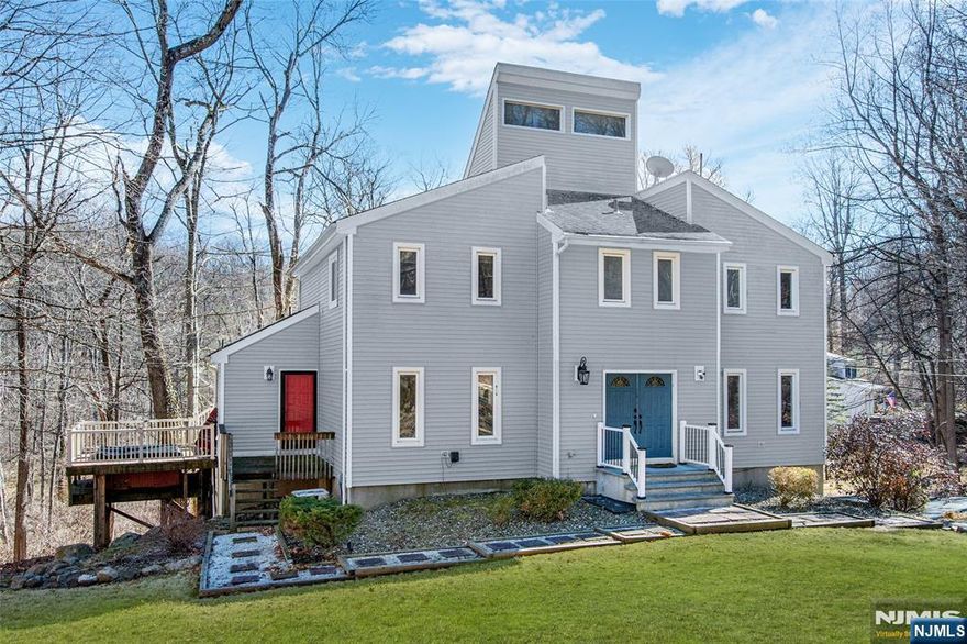 Experience this Fully Renovated Contemporary home in Sparta, just minutes from Lake Mohawk featuring an absolutely MASSIVE BACKYARD with custom Firepit! Upon entry you are greeted by an Open-Concept layout including a modern Eat-In Kitchen with concrete Countertops, Stainless Steel Appliances, custom Backsplash & sleek Cabinetry. The First floor also offers a large Living Room, Formal Dining Room, Powder Room, Mud Room/Laundry Room, and 3 slider doors with access to a Wrap-Around Composite Deck making this home an Entertainers Dream! Ascend upstairs to find 4 spacious Bedrooms including a Primary Suite with Vaulted Ceilings, En-Suite Bathroom with Dual Vanity Sink & Stall Shower, and a Walk-In Closet. Enjoy a Finished Basement and Over-Sized 2 Car Garage featuring a BONUS Storage Room. Conveniently located near restaurants, shopping, and outdoor activities, this home combines style and functionality in a prime location. Sparta offers the #1 School District in Sussex County, Top-Rated Dining, Grocery Stores, Shops, Entertainment, Golf Courses & much more!