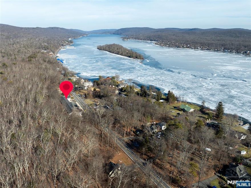 Gorgeous Townhouse with Amazing Views of Greenwood Lake. High Ceilings, Modern Finishes and Open Floor Plan. Kitchen Features Quartz Counters and Large Center Island. Tons of Storage with Large Closets. Full Time Residence or Weekend Getaway at the Lake. Two Porches for Outdoor Entertainment. Overflow Parking for Guests. NJ Transit Bus Stop Provides Easy Transportation to NYC. Located Near Wineries, Apple Orchards & Restaurants.