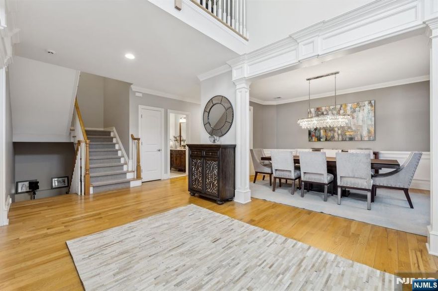 >>>CALL LISTING AGENT ANAT 201.341.4765<<<This luxurious custom-built home, only 15 years young, is nestled in the highly sought-after Maugham School District and boasts over 5,000 sq. ft. of exceptional living space. The grand two-story entrance with a balcony sets the tone for elegance. It leads to a spacious living room, formal dining room, and gourmet kitchen with a breakfast area that flows seamlessly into a cozy family room with a fireplace and access to a deep backyard. The second floor features a stunning master suite with radiant heat, a Jacuzzi, three additional bedrooms, and two baths. The laundry is also on the second floor. The sunny, finished basement offers large windows, a bedroom, and a full bath. Additional highlights include hardwood floors, a security system, a sprinkler system, a central vacuum, and multi-zone heating/AC. Ideally located near NYC transportation, houses of worship, and top-rated schools. This exceptional home is a rare find!