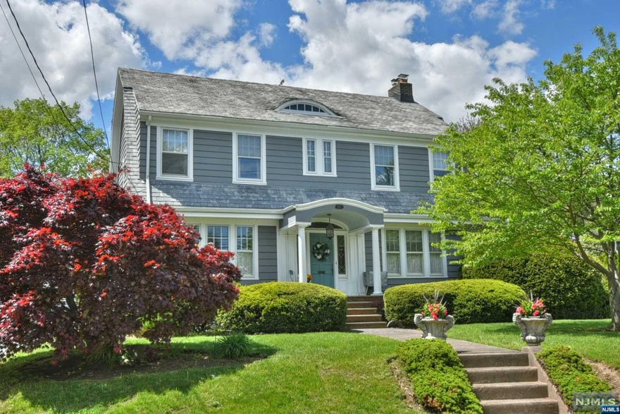 Welcome to this spectacular 3 bedroom Roughgarden colonial in Hawthorne! Located right on the Glen Rock border, this house is sure to please. The first floor features original front entrance door with leaded glass sidelights & arched transom, formal dining room, large living room with fireplace, sun room with fireplace, eat-in-kitchen with breakfast nook overlooking the rear yard, and powder room. The open staircase to the 2nd floor reveals a large primary bedroom, 2 additional bedrooms, and a full bathroom. A staircase to the attic offers tremendous storage space. An additional hidden staircase from the kitchen to the 2nd floor reveals a small room- once a bedroom/living quarters- would make an ideal office! The basement is a full finished space with rec room, family room, powder room, workshop/storage room, utility room, and laundry. The exterior of the home features paver patio & yard with path to the 2 car detached garage & driveway. Must see! Close proximity to train to NYC!!