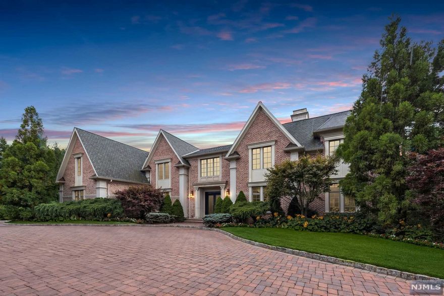 Welcome to this incredible 7 bedroom, 8 full and 2 half bathrooms center hall colonial located in the sought after Tamcrest Estates. This all brick estate is situated on approx 1.8 acres and features a family room with double-sided fireplace and floor to ceiling windows, library with fireplace and French doors, as well as formal living and dining rooms. The gourmet Chef's kitchen is complete with stainless steel appliances, center island and butler's pantry. First floor also features 2 powder rooms, a bedroom suite, laundry room and entrance to the attached 4 car garage. The second level features a master suite with luxurious master bath and fireplace, 4 additional bedroom suites and a family room. The lower level is perfect for entertaining with a large recreation room, media room, exercise room, bedroom suite, wet bar and walk-out to a basketball court. Take the private elevator to all 3 levels. The lush, landscaped backyard includes a pool & spa that are perfect for relaxation.