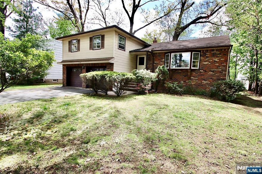 Located in highly sought-after Milnes area, this spacious 3 Bedroom 2 and 1/2 Bath Split Level is ready for a new chapter and so close to schools, NY Trans, Houses of Worship, Bike Path and shopping. 1st Floor offers Entrance Foyer with guest closet, Living Rm w/ vaulted Ceiling and Bay Window, Formal Dining Rm with Sliding Glass Door to Deck, and large Eat-in-Kitchen. Upstairs you will find 3 generously sized Bedrooms, including Primary Bedroom with its own Bath, along with Main Bath. Lower Level Family Room has closet, 1/2 Bath, Lg Pic Window, Entrance to Yard and Ent to 2-car Garage. Partially Finished Basement is ideal for additional living space plus separate work Rm, separate Storage Rm, and Separate Utility and Laundry Rm. 2 Zone newer A/C and heating - With solid construction and well-designed layout, this home is ready for your updates and personal touches offering the perfect opportunity to customize and add value. Enjoy all the amenities Fair Lawn has to offer - town pool, dog park, plenty of parks, activities for all ages, Community Center with walking track & gym, Senior Center, Sports galore - Too many amenities to list - Hurry and make this home yours - Fair Lawn is a great place to raise a family