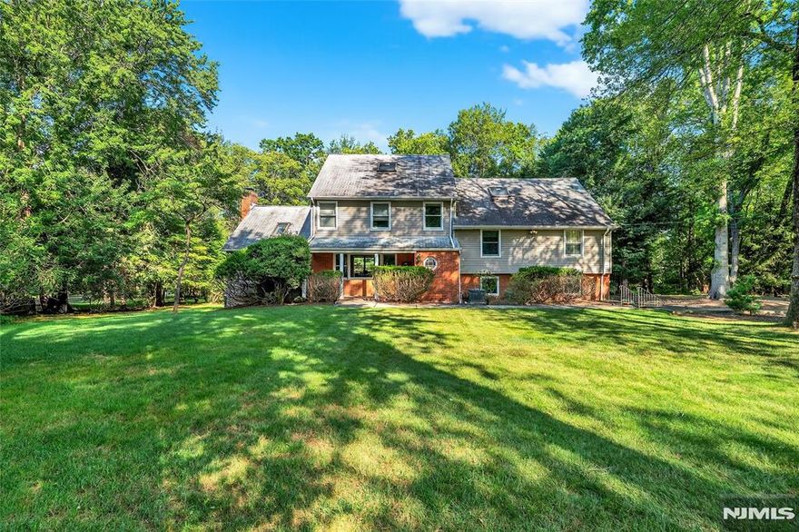 Prime Demarest property on just under one acre. Come renovate or build your own. Approx 11 miles to GWB. House is being sold as is.