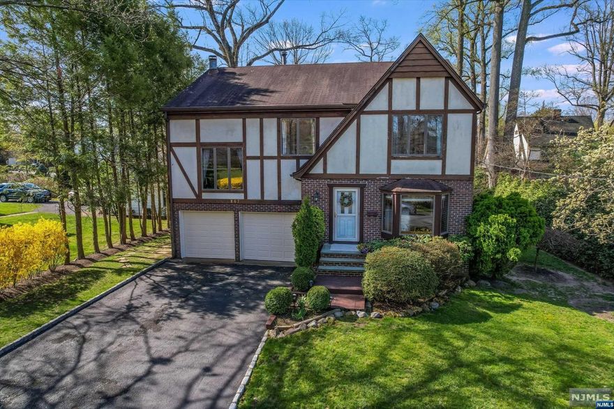 LOCATION, LOCATION LOCATION....4 BEDROOM, 3.5 BATH TUDOR COLONIAL LOCATED ON DEAD-END STREET IN THE HEART OF THE DESIRABLE LATCHSTRING AREA. FORMAL, BRIGHT LIVING ROOM/DINING ROOM COMBO, UPDATED EAT-IN-KITCHEN W/ GRANITE COUNTERS, SS APPLIANCES, PANTRY, 1/2 BATH AND LAUNDRY ROOM W/ DOOR LEADING TO DECK AND PRIVATE LANDSCAPED YARD. UNIQUE FAMILY ROOM LOCATED SEVERAL STEPS UP ON ITS OWN LEVEL W/ WOOD-BURNING FIREPLACE. 3RD FLOOR HAS PRIMARY SUITE AND (3) ADDITIONAL BEDROOMS ALL GENEROUS SIZE WITH PLENTY OF CLOSETS. BASEMENT IS FULL, FINISHED W/ WET BAR, FB AND UTILITY ROOM. HARDWOOD FLOORS THROUGHOUT, 3-ZONE BASEBOARD HEAT AND C/A/C. CLOSE TO TOP-RATED SCHOOLS, SHOPPING, PARKS, AND NYC TRANSPORTATION VIA TRAIN OR BUS.