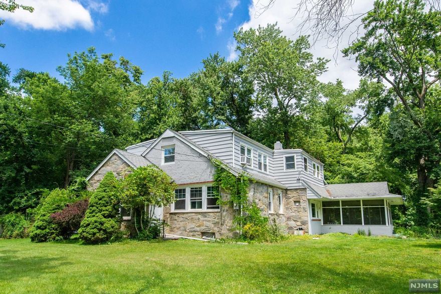 Ideal for Contractor, Landscaper, Gardner - 2.5+ Acres of land boasting one 2 car garage detached and one auxiliary building plus large 4 bedroom home with enclosed porch. Large level expansive lot with home that sits back off the road - home in need of some love but renovations have been addressed with kitchen and bathroom. Home sold as-is. Amazing opportunity to add a little bit of sweat equity and have 2.5+ acres of house and home. Property located in the flood zone.