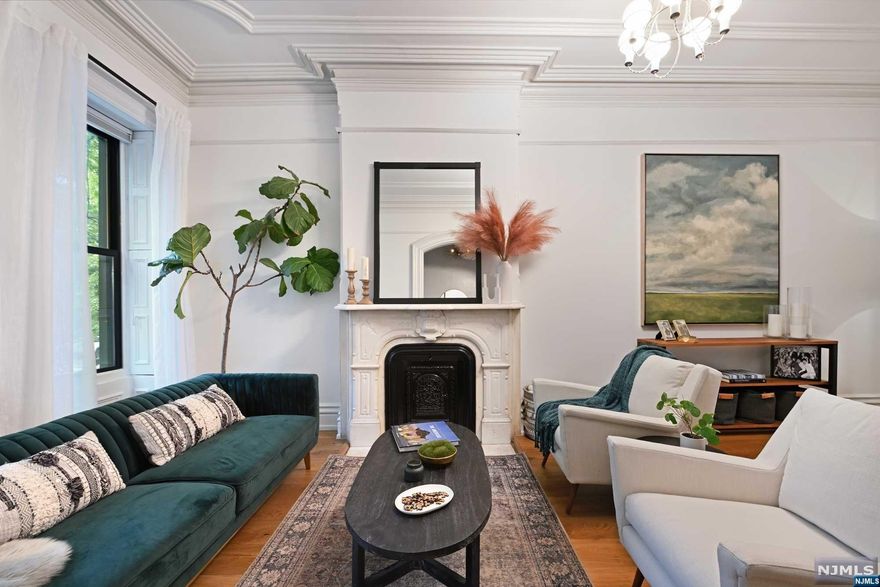 Boasting timeless elegance and modern convenience, this spacious residence offers the perfect blend of historic charm and contemporary flair. Step inside and be greeted by an expansive layout. The sweeping Parlor floor has a focal point of one of the four original marble fireplaces, architectural plasterwork, decorative archways, and pocket doors. This beautiful property boasts modern amenities and thoughtful design elements to enhance your lifestyle. Featuring four generously-sized bedrooms, high ceilings, large Marvin windows throughout, and ample natural light, every corner of this brownstone exudes warmth and sophistication. Experience ultimate comfort and convenience with a state-of-the-art Nest smart home system. Control your thermostat, security cameras, and more, all from the palm of your hand. The kitchen is a chef's delight, featuring sleek countertops, all stainless steel appliances, Wolf Range stove, sub zero fridge, and cabinet space for all your culinary needs. Step