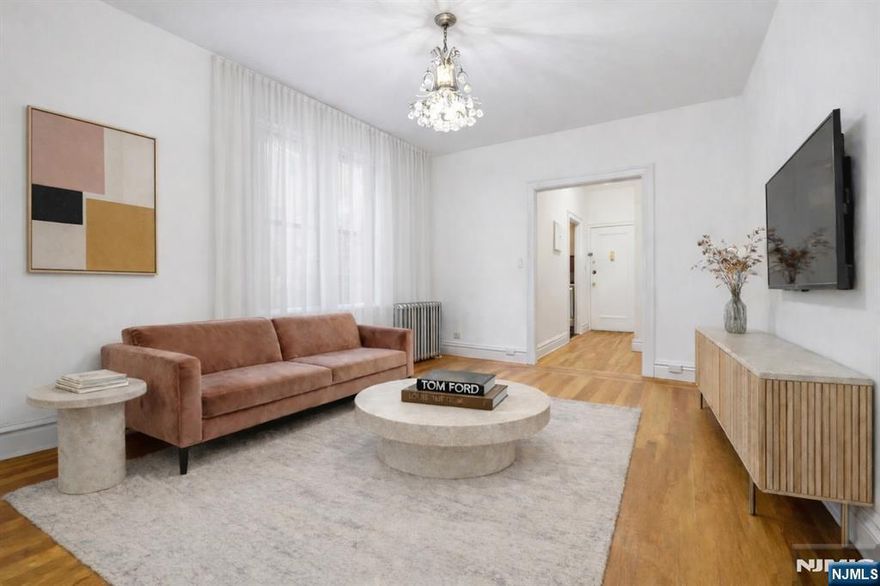 Just refreshed and ready to impressâ€”this beautifully updated one-bedroom home in the heart of Journal Square offers the perfect blend of charm and modern upgrades. Nestled on a quiet, tree-lined block in a well-maintained pre-war building, with on-site laundry facilities and bike storage, this home checks every box for comfort and practicality. This inviting residence features newly refinished hardwood floors that add warmth and character throughout the living and bedroom spaces. The kitchen has been completely upgraded with brand-new flooring and a full suite of new stainless steel Whirlpool appliances, including a gas range, refrigerator, microwave, and dishwasherâ€”delivering both style and everyday convenience. The bathroom has also been thoughtfully refreshed with new flooring, a modern vanity and medicine cabinet. Commuters will love the unbeatable locationâ€”with NYC-bound bus service just one block away, and the Journal Square PATH station minutes away, providing fast, direct access to Manhattan. Enjoy living in one of Jersey Cityâ€™s most dynamic residential neighborhoods, moments away to Lincoln Park, shopping, dining and local favorites, everything you need just steps away. Move-in ready and perfectly positionedâ€”this is the one youâ€™ve been waiting for. Schedule your showing today.