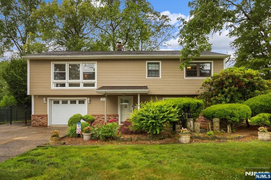 Welcome to Skylines Lakes! Nothing to do but move in to this 4 bedroom, 2 full bathroom raised ranch located at the end of a cul-de-sac. The first floor offers one bedroom, full bath with laundry area, family room, and sun room with a slider to the patio. On the second floor you will find the main living area. Beautiful and bright living room with floor to ceiling windows; crown molding, wainscoting, and custom built-ins; and a gas fireplace. The functional kitchen boasts beautiful cabinets with Ubatuba granite countertops and stainless steel appliances. The dining area has a slider to the deck which overlooks the private backyard. Three bedrooms and main bath round out the main level. After a day at the lake, which is around the block, relax in your private backyard or entertain your new friends and neighbors. Living the lake life provides endless opportunities! Skyline Lakes membership is optional but encouraged. Close to park, beach, and restaurants.