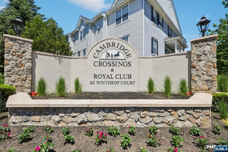 Located in the highly sought-after gated community of Cambridge Crossings, 22 Devonshire Drive offers the perfect blend of style, convenience, and low-maintenance living. This renovated 2-bedroom, 2.5 bath Dorchester model features an open, light-filled floor plan designed for today's lifestyle. The updated white kitchen is beautifully appointed with quartz countertops, stainless steel appliances, and seamless flow into the main living and dining areas. Expansive windows fill the home with natural light, while hardwood floors throughout add warmth and continuity. The inviting living room is anchored by a gas fireplace, creating a comfortable space for both relaxing and entertaining. A first-floor laundry room, powder room, and attached one-car garage add everyday convenience. Upstairs, two spacious bedrooms each offer access to full bathrooms. Thoughtfully updated and move-in ready, the home offers comfortable, functional living in one of Clifton's most desirable communities. Residents enjoy exceptional amenities including a pool, exercise room, sauna, and clubhouse designed for social gatherings and events, all within a pet-friendly environment. Ideally located less than a mile from NYC bus and train access, just minutes to Montclair, and close to Routes 46, 3, and the Garden State Parkway, this home is perfectly suited for commuters and buyers seeking both lifestyle and convenience.