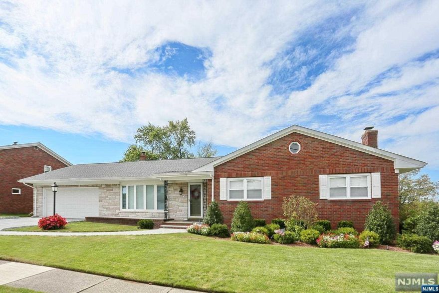 IMMACULATE AND WELL-KEPT BRICK RANCH LOCATED ON A BEAUTIFUL TREE-LINED STREET. STEP INTO A LOVELY OPEN ENTRY FOYER, LARGE LIVING ROOM CONNECTED TO A FORMAL DINING ROOM WITH ACCESS TO A COVERED PORCH PERFECT FOR MORNING COFFEE. UPDATED EAT-IN KITCHEN WITH LARGE ISLAND, QUARTZ COUNTERS, AND SS APPLIANCES. THE FIRST FLOOR CONTINUES WITH EASY ACCESS TO THE LAUNDRY AREA, FULL HALL BATH, AND (3) GENEROUS-SIZED BEDROOMS, ONE IS THE PRIMARY SUITE WITH TWO GENEROUS-SIZED CLOSETS. THE BASEMENT IS FULL AND FINISHED WITH 1/2 BATH, UTILITY ROOM AND WALK-OUT TO GARAGE. HARDWOOD FLOORS THROUGHOUT, UPDATED 200 AMP ELECTRIC, HWH, ROOF, PAVER DRIVEWAY, WALKWAY, SPRINKLERS, BEAUTIFUL LANDSCAPING, AND AN OVERSIZED 2-CAR GARAGE. EASY ACCESS TO ALL HIGHWAYS, SHOPPING, AND NYC TRANSPORTATION.