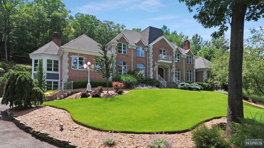 Quality, location, & breathtaking curb appeal effortlessly blend as this Country French Classic provides a perfect backdrop for living & entertaining. Located in the heart of what is arguably the most sought after street in Franklin Lakes, this distinguished residence is complete w/ a resort-like back-yard experience. Comfort abound, the home & property boast: breathtaking mtn views, custom full brick facade, approx. 7,400 sf incl w/o bsmnt, 6 bdrms w/private full bths + addl maids qrters on lowest level, tremendous 1st flr master ste featuring FP/palatial his-her bath w/sauna & more, elevator, soaring ceilings, custom marble finishings, 4 fireplaces, 4 car grge, ample privacy/security, incred rear pool/gazebo/spa w/ bomanite patio, heated drive, designer roof, video security, audio system & so much more!