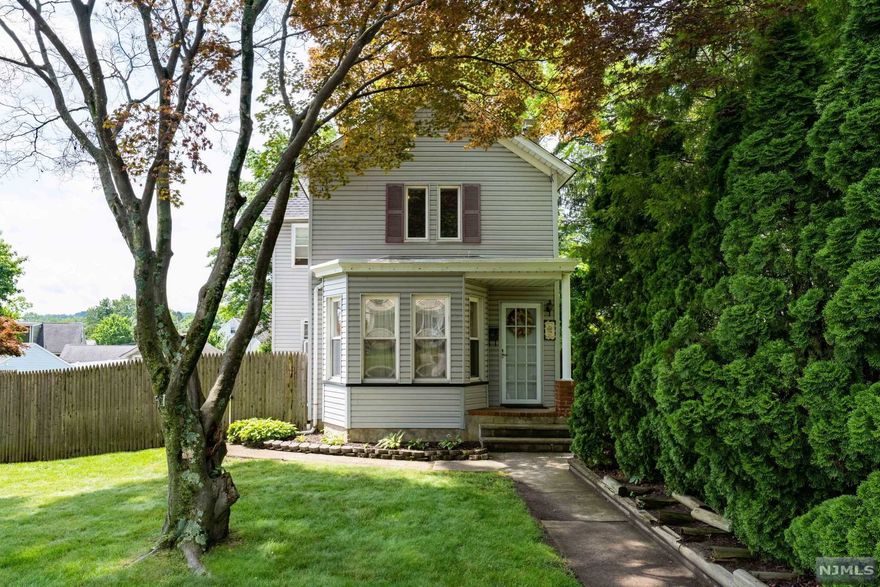 Warm and charming colonial home with a fully fenced in yard. Private with mature trees. Updated eat in Kitchen, great Family Room with stone fireplace and a Formal living room. Laundry on the first floor for added convenience. Nice size deck overlooks the lovely yard. Plenty of off street parking plus a 1 car detached garage.