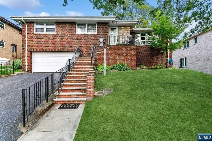 Bright and beautiful 2-family home! One side offers 3 bedrooms and 3 full bathrooms. The open layout includes beautiful sun-filled bay windows, hardwood floors, and granite countertops. Additionally, there's a spacious finished basement with a private entrance, closets, a full bath, and washer & dryer. The home also features a 2-car garage. The other side of the house comprises 3 bedrooms and 2 baths, along with a living room featuring a wood-burning fireplace. Ample closet space and a washer & dryer are available. The house is equipped with 2-zone heating and central air conditioning. A side yard is also included in this 2-family home. The property is located in a friendly and quiet neighborhood, conveniently close to transportation and shopping.