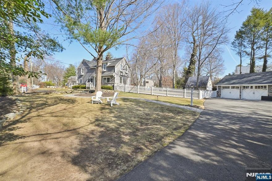 Welcome to this completely updated and perfectly appointed West Side Colonial. Situated in the coveted Willard School district, this home is truly move in ready. There is a bright and open FLR with woodburning fireplace, a FDR, pretty sunny updated kitchen and large Family Room that leads to the deck and gorgeous yard. Upstairs are 3 bedrooms, the Primary being ensuite with a walk in closet and convenient laundry. The lower level playroom and office with Full Bath could be a guest room or fourth bedroom. There is a separate two car garage. The lovely parklike property allows for endless opportunity for future expansion and a possible pool. This is a true gem not to be missed.