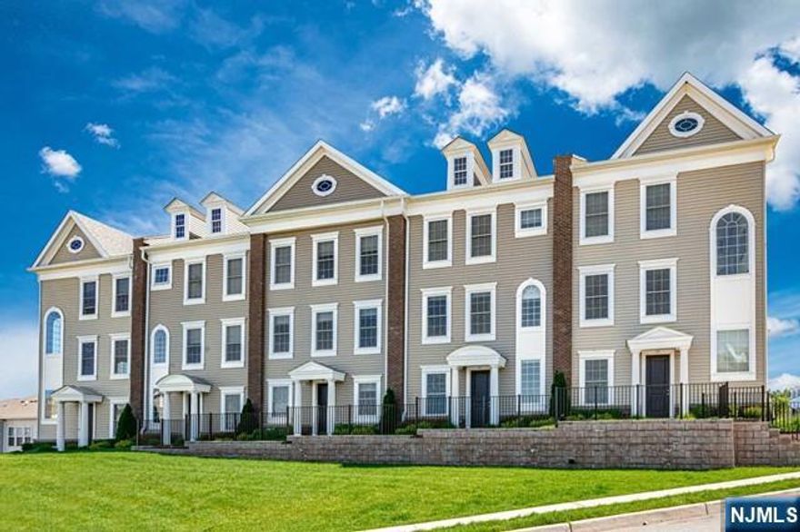 Welcome home to this stunning, sun drenched 4 Bedroom / 3.5 Bathroom townhouse conveniently located in Wright Place at Wesmont Station. Stretching across 2,258 SqFt, this Carolina model home features only the finest finishes throughout three levels of living space with hardwood floors, recessed lighting, and high ceilings. First floor features welcoming entry foyer, bedroom, full bath, and two car garage perfect for everyday living. Main living space on the second level includes an open concept with living room, Chef's kitchen, dining room, half bath, and outdoor deck. Chef's kitchen features SS appliances, quartz countertops, custom cabinets, and breakfast bar. Completing this beautiful home is a master bed with ensuite bathroom and two walk-in closets, two guest bedrooms, full bathroom, and laundry room. Wright Place at Wesmont Station features NJ Transit Train Station, Dunkin Donuts, Wesmont Liquors, and Dogtopia. Don't miss out on this gorgeous home!