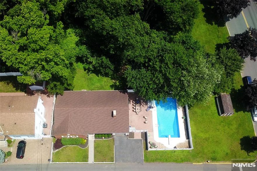 SHOWN BY APPOINTMENT this Friday, Saturday and Sunday 11-4. Welcome to 76 and 72 Central Lane. Nestled in the quiet, north end of town, this beautifully maintained 3-bedroom, 2.5-bath home offers the perfect blend of space and comfort â€“ ideal for those ready to settle into this welcoming Secaucus neighborhood. The main floor of this ranch-style home boasts an inviting living room with a cozy wood burning fireplace that flows into a dining area overlooking picturesque nature of Schmidtâ€™s Woods. The spacious primary suite features a large walk-in closet and en-suite bath, while two additional bedrooms provide the flexibility you needâ€”whether itâ€™s for guests or a dedicated home office. The finished basement is suitable for an entertainment room, office or home gym and offers plenty of storage as well as a laundry room. Pass through a cozy, windowed three-seasons room into your private, fenced-in yard with an in-ground pool. An outdoor oasis perfect for summer gatherings and leisurely swims. This move-in ready home also features a 2-car driveway and a 1-car garage with direct access to the three-seasons room which could double as a mud room. This corner double lot property is located within walking distance to schools, parks, recreation center, town pool, and scenic walking trails, perfectly positioned for an active, connected lifestyle. With regular community events, youâ€™ll feel right at home from day one.