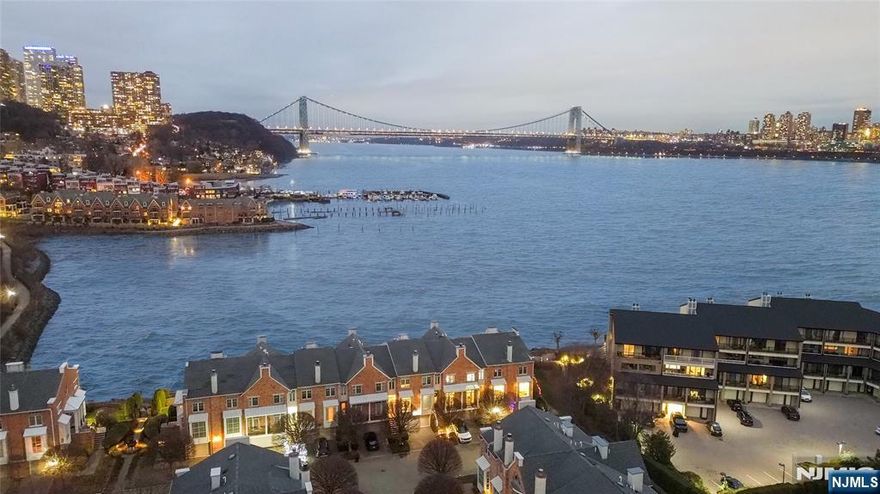 Enjoy sweeping, unobstructed views of the NYC skyline and the George Washington Bridge from the family room and expansive deck with retractable awning, a true front-row seat to the city. This rare Hudson Cove townhome offers approximately 3,200 sq ft of meticulously renovated living across three levels, featuring 4 bedrooms and 3.5 baths. High-end architectural details define the home, including soaring ceilings, coffered accents, cove lighting, custom millwork, a gas fireplace, and a grand staircase. The chefâ€™s kitchen is designed for both beauty and performance with Viking stainless steel appliances, a 6-burner range, and industrial-grade ventilation. Retreat to the spa-inspired primary suite, your private sanctuary at dayâ€™s end. Hudson Cove is a gated waterfront community offering a pool, jacuzzi, and a scenic promenade along the Hudson River, luxury living with unmatched views and privacy.