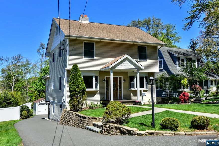 This meticulously maintained four-bedroom, two bath, colonial home is located just minutes from the fabulous Main Street Ramsey. Youâ€™ll love how conveniently located this home is to shopping, hair salons, charming cafes, schools, both fine and casual dining, and the Ramsey train station. Inviting curb appeal, a large lush yard for entertaining or play, parking for up to 5 cars and an EV charging station are just a few of the added features that make this the perfect place to call home. This pristine home has a first floor that boasts a welcoming living room with a wood burning fireplace, and a beautiful sunlit dining room with sliding doors to the outside deck, which is perfect for al Fresno dining. Completing the first floor is family room/den area to watch your favorite movies, a full bath and a spacious kitchen equipped with lots of cabinets, stainless steel appliances, and ample counter space - making it ideal for the person who loves to cook! Upstairs offers another full bath and four nice sized bedrooms, including the primary bedroom which has two large closets! The walkout basement adds extra living space with a generously sized recreation room and a separate area for laundry and storage. Additional features include: 3 Zone Heating system, Boiler (2018), Central Air (2021), Roof (2016), Detached Garage (2018), Driveway Blacktopped and Lined with Belgian Block (2020). This move-in ready house is impressive both inside and out!