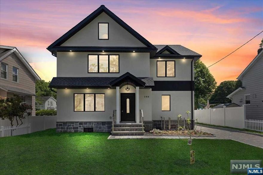 Sought after Modern Luxury single-family home, 280 Hickory Ave.resides in Bergenfield and borders Tenafly and Creskill. Nestled mere Minutes from Manhattan and public transportation, this estate grants easy access to schools, parks, and places of worship. This Colonial home has so much to offer, showcasing an open concept, featuring a gas burning fireplace. The first floor leads to its ultra sleek stainless gourmet kitchen with luxury appliances, built-in microwave and wine cooler, quartz countertops and island, and beautiful Anderson windows that match sliding doors leading to a large outdoor deck overlooking well manicured landscaping. With 5 Bedrooms and 4 Bathrooms, this residence is perfect for large families or guests, including a massive home theater with massage chairs. The dwelling also features a spacious, elongated 6 car driveway and a 2 car garage that includes an additional heated and air conditioned unit, perfect for entertainment or office space.