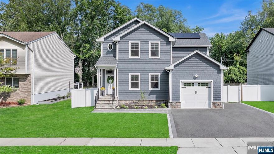 Gorgeous, New, and Just 12 Miles to the GW Bridgeâ€”This One Has It All! Built from the ground up in 2020, this Colonial farmhouse stands out in every wayâ€”set on a deep, private lot with no homes behind. Inside: soaring ceilings, hardwood floors, Andersen energy-efficient windows, and a show-stopping kitchen with quartz island, Bosch appliances, and two pantries. The open layout flows into a sun-filled family room with a gas fireplace and direct access to a fenced yard with paver patio and in-ground sprinklers. Upstairs, the primary suite feels like a getaway with two walk-in closets and a beautifully finished bath with a spacious walk-in shower. Smart-home features, solar, upstairs laundry, and a 4-car driveway complete the package. Move right in and love where you live!