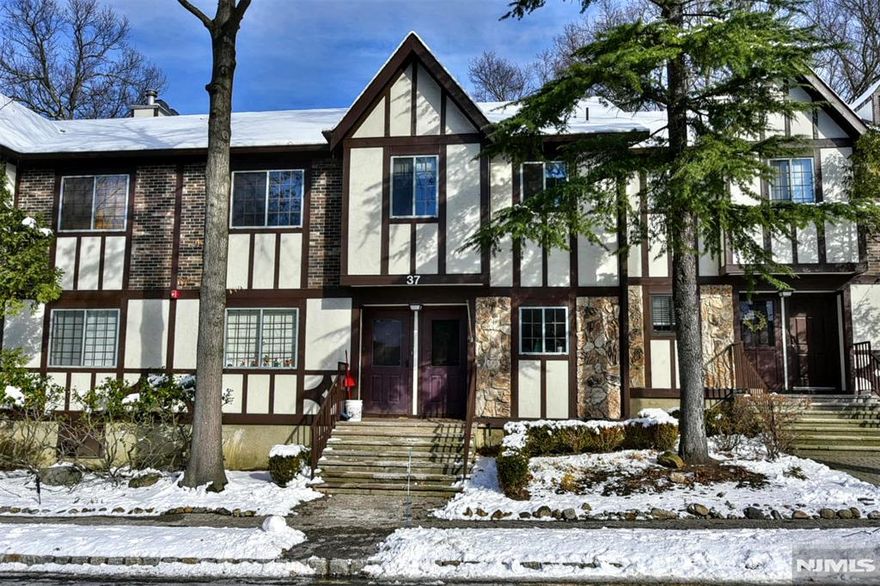 Move right into this well maintained, freshly painted 2-bedroom, 2-bathroom condo featuring an updated kitchen, living/dining room combo, wood-burning fireplace, in-unit laundry, and a covered deck. Additional storage included. Enjoy one floor living and the Ridge Gardens lifestyle with parking, on-site management, and amenities just steps from your doorâ€”outdoor pool, tennis and pickleball courts. Ideally located close to shops, schools, highways, NJ Transit, and minutes from Ramapo Reservation, Darlington Lake, and Campgaw Ski Area. Hiking, skiing, and everyday convenience are all within easy reach. A perfect blend of comfort, location, and community living awaits!