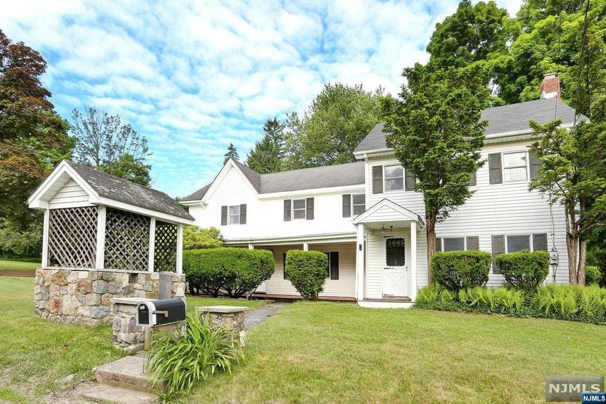 Run, don't walk to see this charming and updated four bedroom, two and a half bathroom home conveniently located in the heart of West Milford! This home is situated on over 2 acres and has so much to offer the next homeowners, there is nothing to do but move in! Viking range, stainless steel appliances, and the layout/counter space needed to make any chef or baker happy! The kitchen opens to the dining room and further into the living room with fireplace. A true entertaining floor plan to enjoy all the fuits of the labors made in the kitchen! The primary suite has a private staircase leading to a large bedroom, generous walk-in closet with organizers, and an updated bathrooom! Up the other stairs you will find three bedrooms and another full bathroom including a clawfoot tub! Exiting the kitchen through the mudroom/laundry room you enjoy the vast lawn with mature trees and a patio on which to relax! Oversized three car garage which includes a heated work room and hang out room!