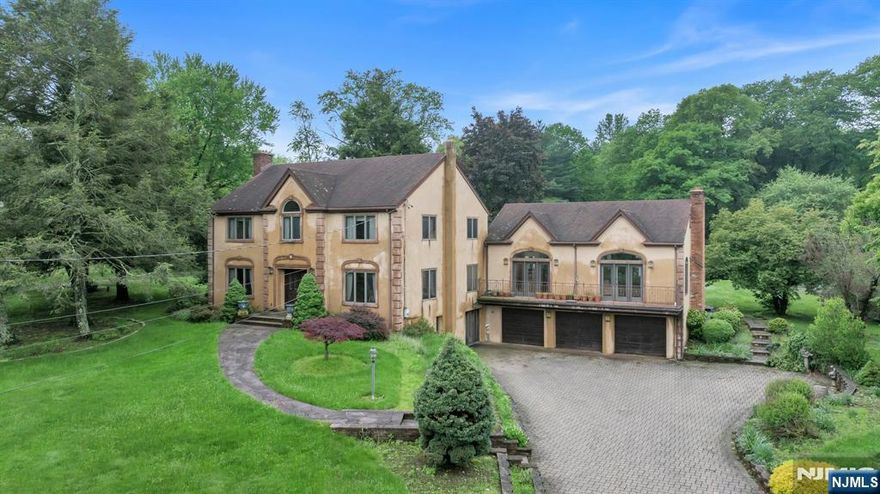 Welcome to this Colonial Style single family home with Scenic Views & Expansive Living Space. Experience timeless elegance and modern comfort in this impressive Colonial-style estate, offering over 6,600 sq ft of finished living space on a 1.848-acre lot in a serene, scenic setting overlooking the Haledon Reservoir and Franklin Lakes Nature Preserve. Features 4,614 sq ft main home + 2,010 sq ft finished walk-out basement, 13 rooms total, including 6 spacious bedrooms and 4 full bathrooms, Hardwood and tile floors throughout, Summer kitchen, Accessory Unit, 1,251 sq ft separate structure â€” perfect for a guest suite, home office, studio or additional garage. Expansive 2,258 sq ft deck, Two driveways for added privacy and access, 3-car attached garage, 1 detached garage totaling 4 garages. Enjoy tranquil surroundings with unmatched access to outdoor recreation, all while being just minutes from major highways, top-rated schools, dining and shopping.This one-of-a-kind property blends luxury, flexibility, and privacy â€” a true gem in an exceptional location.