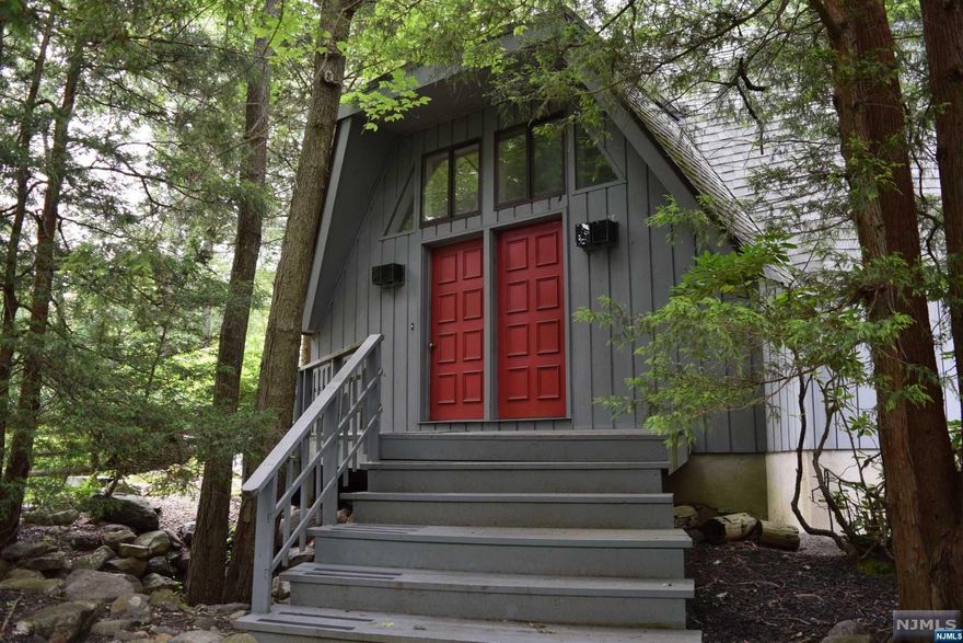 Smoke Rise Gated Community..Buckminister Fuller DOME HOME..Unique Home being sold AS-IS 3 Bedrooms 2 1/2 Baths walk out basement with garage.Unique style skylights in home bring in beautiful Natural light! Kitchen with Corian tops,Wood Fireplace, 3 season room off Family Rm,Sliders to Deck, Fenced..Home in need of much TLC......