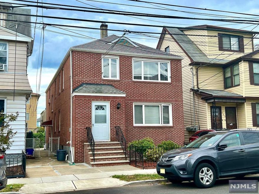 Lovingly maintained brick 2-family located 1 mile from Harrison PATH station. Both apartments similar sized 2 bed/1 bath with spacious rooms. Living Room: 13'5"x17', Dining Room: 14'10"x10'4", Kitchen: 14'9"x10'4", Bedrooms: 10'x14' and 14'x10'. Newly renovated 1st Fl features modern vinyl plank flooring throughout, freshly painted walls, SS kitchen appliances, and quartz countertops. 2nd Fl original hardwood in excellent condition throughout with kitchen renovated in 2011. Basement partially finished with large rec room 22'x20' and half bath. Front & right side of roof replaced last year with gutter screens. Boiler for heat replaced Aug 2018. 1 off-street parking space and low maintenance paved concrete patio complete this move-in ready home. Entire property will be delivered vacant.