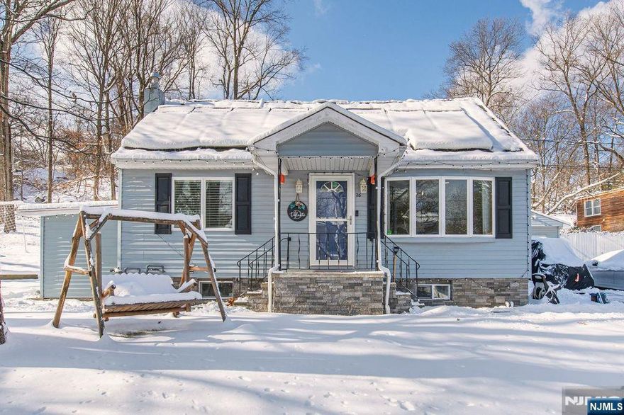 Desirable expanded Cape Cod located in lower West Milford. This entertainer's paradise offers 3 bedrooms, a newer designer kitchen with farmhouse sink, sliders from the dining room to the rear yard, 3 full baths, a bright, sunny living room and a fully finished basement. The outdoor space features a large above ground pool with a wrap around deck, plus two spacious side yards providing ample room for play. Bonus: all outdoor play gym equipment is included. Set on a beautiful, tree-lined corner lot in a convenient town center location with easy access to shopping, major highways, and main roads. Large lot.