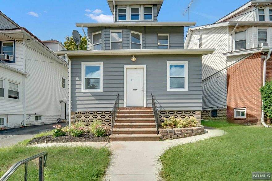 Spectacular renovated 2-family. Impressive is an understatement when it comes to this beautiful residence. Front porch, ideal for a cup of joe. Elegant foyer w/ beautiful architecture & stained glass. Beautifully modernized, 2 family home boasting w/ sunlight. Gleaming brand new espresso hardwood floors, 2 white stylish kitchens w/ quartz countertops, all bathrms renovated w/ subway tiles & eclectic fl tiles.1st fl unit features a spacious living/dining rm, 2 bedrms, 1 full bath & private enclosed porch. 2nd fl unit includes 2nd and 2rd fl living space, generous living rm w/ lots of windows & formal dining area adjacent to kitchen. 3 bedrms, 2 full bathrms, 3rd fl primary suite w/ exquisite walk-in rain shower & bonus rm for home office. Renovated finished basement & 2 car garage. Close to shops & NYC Trans