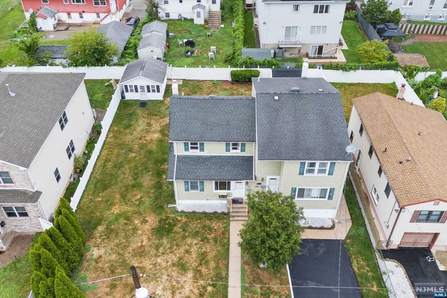 Explore an exceptional real estate opportunity in Secaucus, NJ, with this spacious two-family home set on a generous 80x105 lot. Just 15 minutes from NYC, this property offers a prime location and versatile living options. The side-by-side layout ensures ample space and privacy for each unit. Unit 1 features a comfortable living room, dining room, kitchen, 1.5 baths, and a dining room that opens onto a private deck and backyard perfect for entertaining or relaxing outdoors. Unit 2 Includes three bedrooms, a living room, kitchen, and a full bath, offering plenty of room for families or guests. ALL separated utilities for both units! Convenience is a major highlight, with Secaucus Junction just a short distance away. NJ Transit trains from Secaucus Junction get you to Penn Station in a swift 10 minutes, making your commute to NYC a breeze. This property is ideal for investors or families seeking a spacious home with easy access to the city.