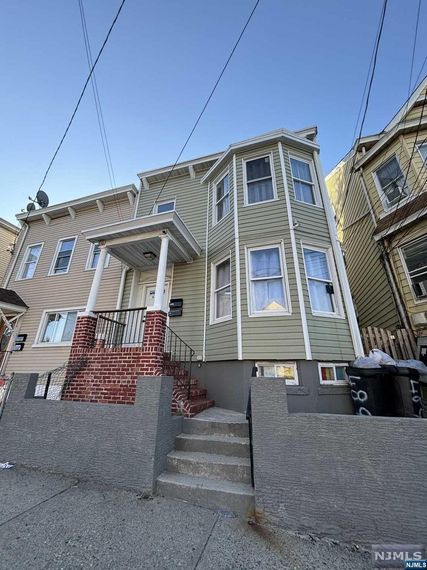 Renovated legal 2 family in quiet area. 1st fl has 2 bedroom, living room, eat-in-kitchen and bath. 2nd fl combined with attic has a total of 4 bedrooms, living room, eat-in-kitchen and 2 baths. All separate utilities. Basement is finished. Roof is less than 6 months old. Boiler and hot water heater (2 years old). LOW TAXES.