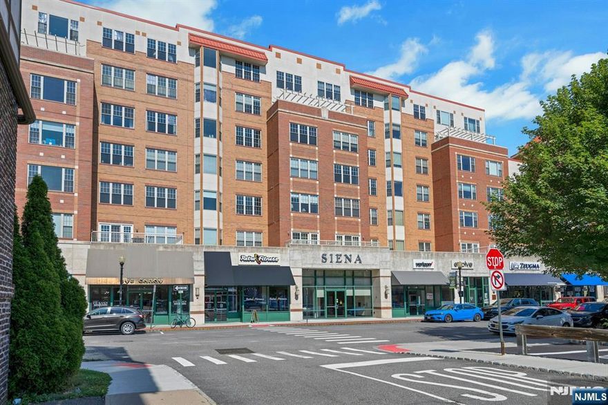 Lovely two bedroom, two bath located in the heart of downtown Montclair. The apartment features hardwood floors, open floor plan with kitchen opening through the breakfast bar to living & dining area. Kitchen has lots of storage, granite counters and closet in the foyer for coats and overflow pantry items. Primary suite has it all: large walk in closet, stackable washer & dryer, spacious shower and double sink. The apartment has lots of closet space, brightly lit with large west-facing windows that showering the apartment with afternoon and evening light. You will enjoy entertaining or just relaxing on the rooftop deck with views of NYC and downtown Montclair. All convenient living with door-person/concierge, underground assigned parking, NYC bus on corner and NYC train a few blocks away. Right outside the front door you will find Gym & Fitness Club, Starbucks, all the excellent restaurants that Montclair is known for, art galleries, Montclair Art Museum, live-performance theater at the Wellmont, cinema and shops including a Whole Foods a few blocks away. Life is good in trendy and exciting Montclair downtown.