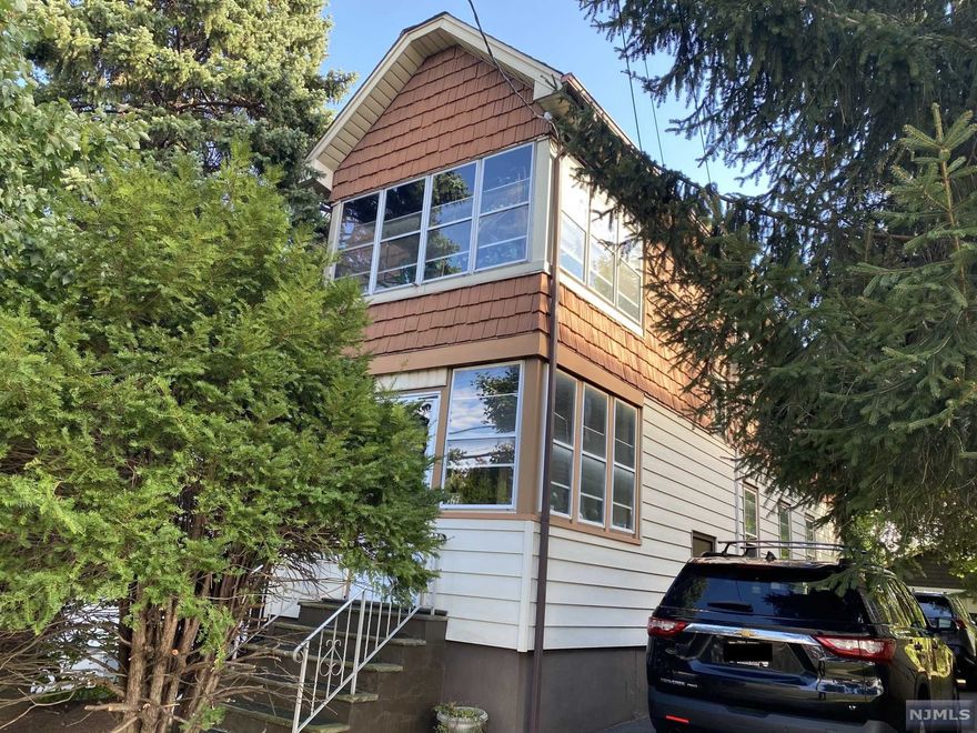 Located in an excellent location. Lots of potential. Legal two family. Two car detached garage in the back. Separate utilities. No oil tank. Each unit has a porch, living room, formal dining room, kitchen, full bath and two bedrooms. Large basement with a separate entrance. Two gas furnaces. Two water heaters. Sold strictly as is!