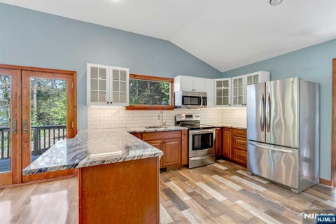 Photo of 551 E Shore Rd, West Milford, NJ 07421 (MLS # 26034032)