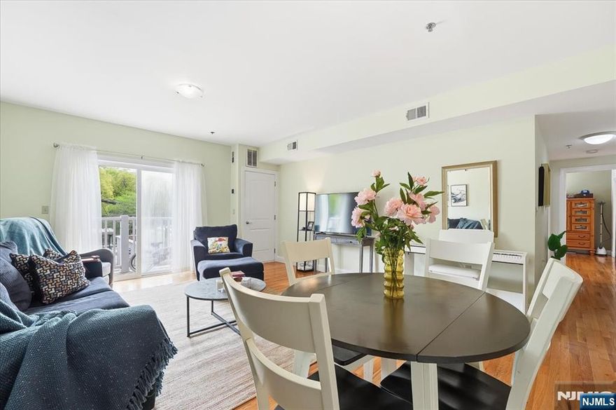 Experience the perfect blend of modern convenience and urban tranquility in this expansive 1,171 square foot residence at Branch Brook Commons. This bright and airy 2-bedroom, 2-bathroom home features a sprawling open-concept living and dining area highlighted by gleaming hardwood floors and a private balcony perfect for outdoor relaxation. The chefâ€™s kitchen comes fully equipped with a suite of stainless steel appliances, premium countertops, and ample custom cabinetry. Retreat to a spacious primary suite boasting a massive walk-in closet and a private en-suite bathroom with a soaking tub and contemporary finishes. The versatile second bedroom is ideally situated for a home office or guest room, located just across from the second full bathroom. In-unit laundry and central heating and cooling ensure effortless daily living. Residents enjoy access to an on-site fitness center and the security of a gated, assigned parking space in a professional elevator building with intercom access and 24-hour surveillance. Located directly across the street from the Newark Light Rail, this home offers a seamless 10-minute connection to Newark Penn Station for an easy commute to Jersey City and Manhattan. You are also just steps away from the historic 360-acre Branch Brook Park, famous for its scenic trails and world-class cherry blossom collection. This move-in-ready condo offers a rare combination of space, security, and unbeatable transit access.