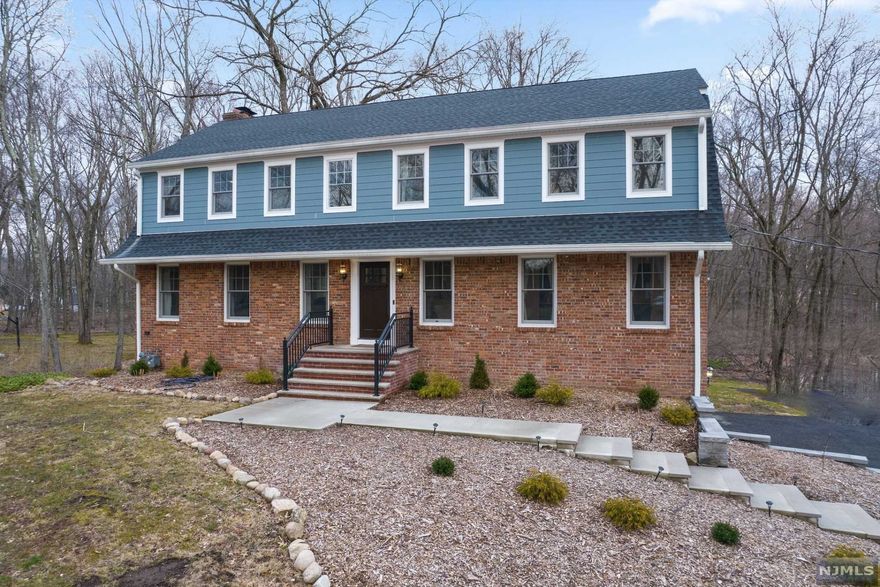 Set on 2 ACRES on a desirable picturesque street this recently completely renovated, 4 bedroom, 2.5 bath, Center hall Colonial is set back off the road on a 154 X 599 private property. Modern open layout, 1st.floor entry foyer, powder rm, formal living rm, family room with fireplace, open dining room, chef's kitchen w/ beautiful finishes and walk out to a huge entertaining deck overlooking acre of privacy. The 2ND. Floor offers a master br with full bath/ss and 2 walk in closets, 3 more bedrooms w/ lots of closet space, hallway full bath/sot and convenient laundry room . The basement has a finished recreation rm /fpl, with sliding doors leading onto the rear concrete patio, entry from the 2 car attached garage and utility rm. Desirably located close to schools, shopping and NYC transportation. This property won't be on the market for long.