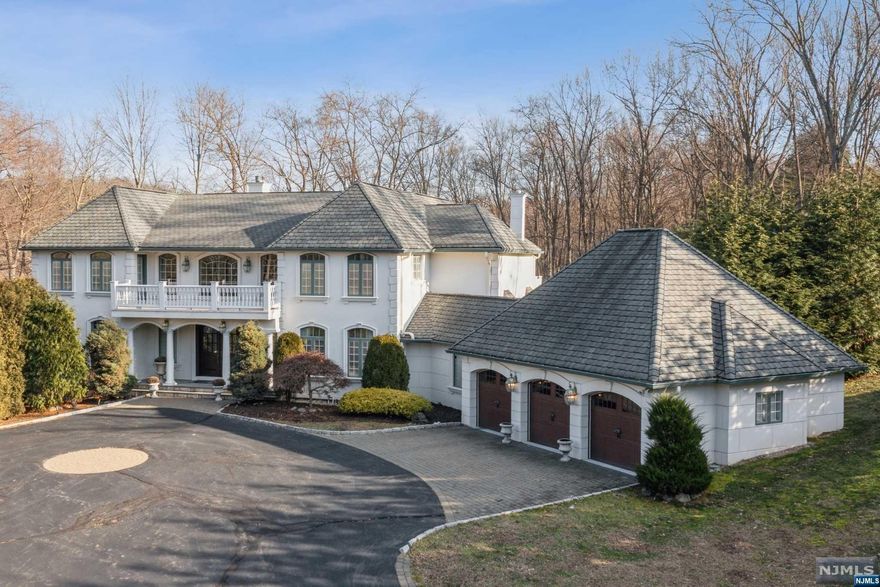 This magnificent home w/elegant details is your chance to own a piece of luxury! A two story grand scale entry featuring an alluring bridal staircase serves as the interior's focal point. Incredible living spaces flooded w/natural light & high ceilings give an amazing sense of volume. Hardwood flrs & intricate moldings adorn the warm & sophisticated interior. Dramatic great rm w/custom fireplace, wet bar & french doors lead onto Trex deck overlooking an acre of private grounds. Custom Salerno gourmet kitchen w/walk-in pantry. Powder rm & first flr bdrm w/full bath complete the main flr. Relax in your luxurious primary suite w/fireplace, french doors to private rear balcony, WIC & spa-like bthrm. Two additional bdrms, w/jack&jill bthrm complete the 2nd flr. Amenities include: radiant & baseboard heat, surround sound, top of the line appliances & fixtures including Pella windows, 2 Laundry Rooms, 3+ car garage. Full unfinished walk-out basement w/10ft ceilings offers a blank canvas!