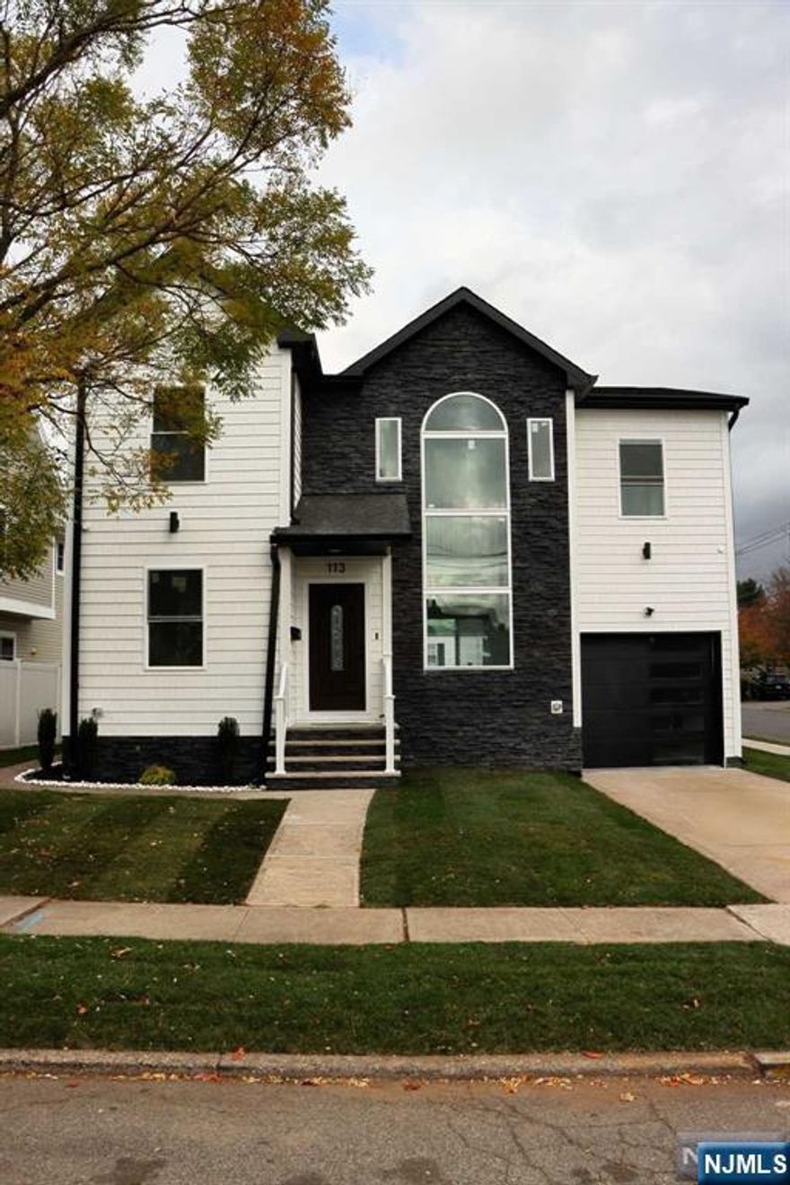 Discover this newly built home on an established foundation, offering modern living with classic charm. Featuring five bedrooms and four and a half baths, this spacious residence includes a primary suite with a walk-in closet and an ensuite bathroom. The open-concept living area welcomes you with abundant natural light, creating an inviting space for both relaxation and entertaining. To the left of the entrance, you'll find a dedicated office, perfect for remote work. Two additional bedrooms each come with their own bathrooms, providing comfort for family and guests. The partially finished basement offers versatile potential for a recreational area or storage. Enjoy central air, a one-car garage, and ample parking in the front and side of the home. Step outside to a new deck, ideal for gatherings or peaceful evenings. Located less than 30 minutes from NYC, this home perfectly balances suburban tranquility with city accessibility. Don't miss out on this exceptional property!