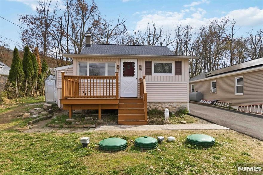 Lake views without the lakefront price tag. This charming 1 bedroom, 1 bath ranch with a loft sits directly across from Cozy Lake and comes with an optional lake membership that gives you access to a private beach, swimming, boating, paddle boarding, and fishing, all within walking distance from your front door. The kitchen and bathroom were both updated in 2023, and a brand new septic was installed in 2024. The loft adds flexible space, whether you use it as a second sleeping area, home office, or extra storage. You're minutes from Routes 23 and 15, shops, restaurants, and the center of Jefferson. Plus, the Berkshire Valley Golf Course is right outside of the neighborhood. This home works perfectly as a primary residence or an investment property.