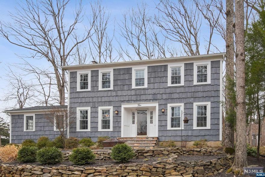 With a spectacular location in Shongum Lake with water views and deeded lake rights, this 4br/2.5 bath colonial is ready to move right in on over half an acre of flat property . Hardwood floors throughout and a kitchen addition in 2013 add to the allure of country living at its best in this fabulous lake community. Large living and dining room flank the entry foyer and the family room boasts beamed ceilings and a fieldstone fireplace leading out to an entertainment-sized deck. Four generous-sized bedrooms upstairs with primary ensuite bath and an office/bedroom downstairs give you the space you need to entertain. A powder room conveniently located on the first level. The partially finished basement has a large rec room with kitchenette sink & extra storage in the utility area. Recent updates include new windows (2022), roof (2023), & furnace (2023) plus city sewer & water. The Shongum Lake Community features a clubhouse, beach, boating, swimming, and a social events to enjoy.