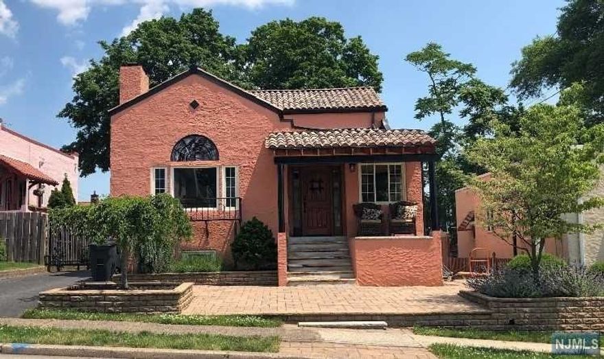 CLASSIC SPANISH MEDITERRANEAN COLONIAL HOME. FEATURING STUNNING LR WITH BEAMED CATHEDRAL CEILING, WOODBURNING FIRPLACE AND ROMANTIC JULIET BALCONY, OVERLOOKING FORMAL DR, GORGEOUS UPGRADED STAINLESS STEEL KITCHEN WITH ISLAND. 4 BR'S 2 FULL 1 HALF BATHS. INLAID HARDWOOD FLOORS THROUGHOUT, SHOWCASING THIS HOME IS A NEW (2YRS) AUTHENTIC TERRACOTTA TILE ROOF. OTHER MUST SEE LIVING FEATURES ARE FULL FINISHED BASEMENT AND QUAINT ENTRYWAY READING PARLOR. NYC SKYLINE CAN BE SEEN FROM ONE OF THE UPSTAIRS BEDROOMS. NEAR SCHOOL, HIGHWAYS, MALLS, TRANSPORTATION.